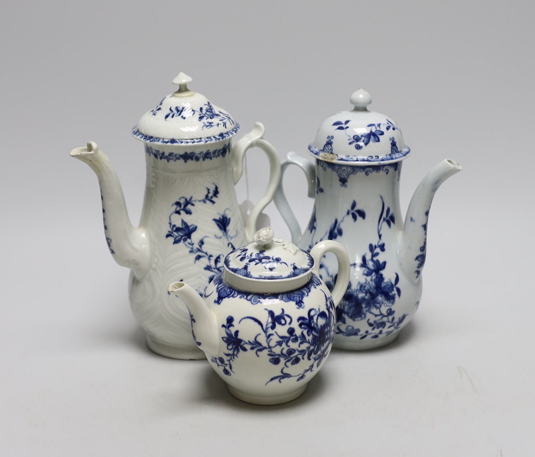 Two 18th century Worcester Mansfield pattern coffee pots and a similar teapot, (all with covers) tallest 22cms high